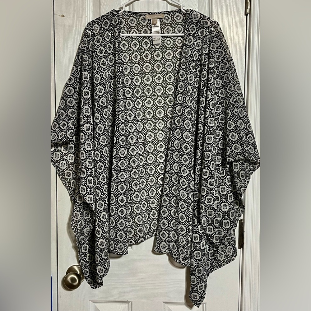 Woman Within Monochrome Geometric Poncho